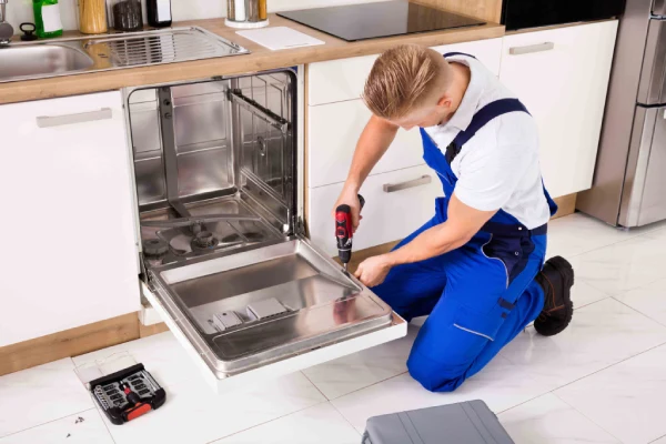 Technician is Fixing Dishwasher