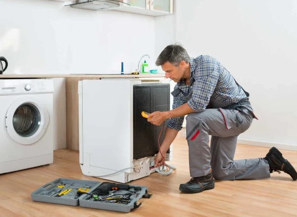 Technician is fixing Dryer 